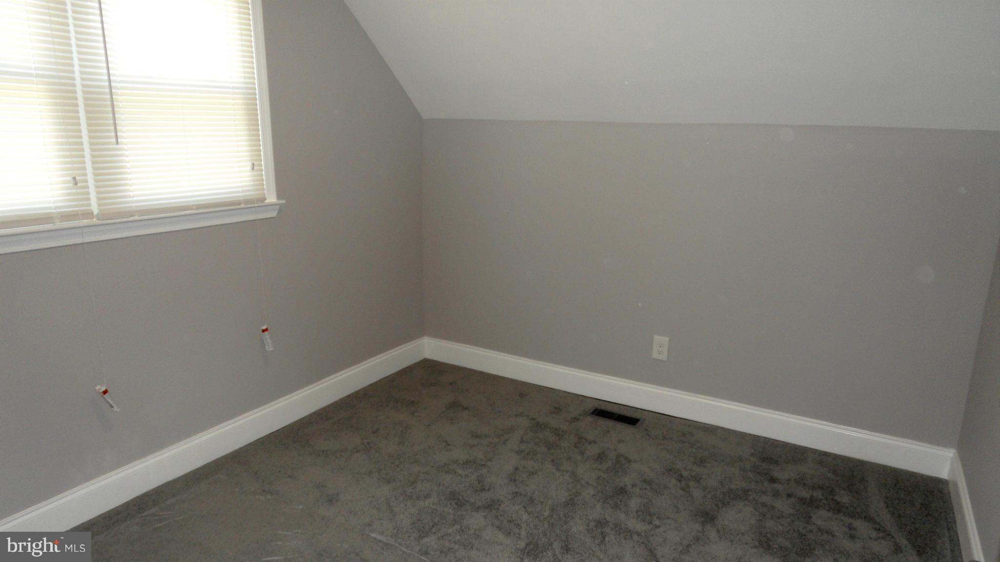 3832 Byfield Road Baltimore, MD 21207 - Photo 16 of 30 an empty room with a window