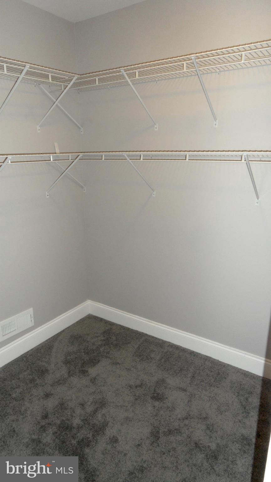 3832 Byfield Road Baltimore, MD 21207 - Photo 17 of 30 a view of an empty walk in closet