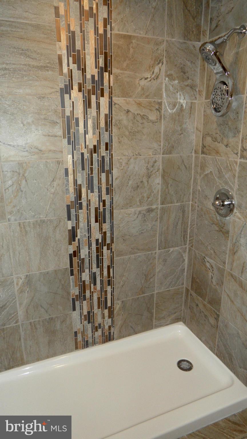 3832 Byfield Road Baltimore, MD 21207 - Photo 20 of 30 a bathroom with a bathtub and shower
