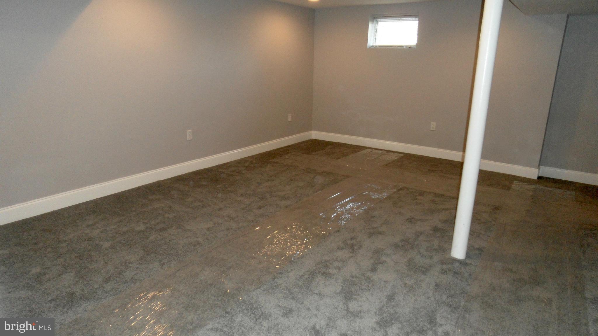 3832 Byfield Road Baltimore, MD 21207 - Photo 22 of 30 an empty room with a workbench