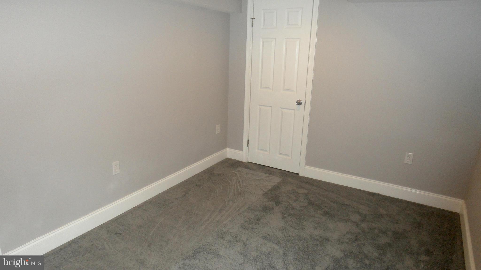 3832 Byfield Road Baltimore, MD 21207 - Photo 25 of 30 an empty room with an entryway