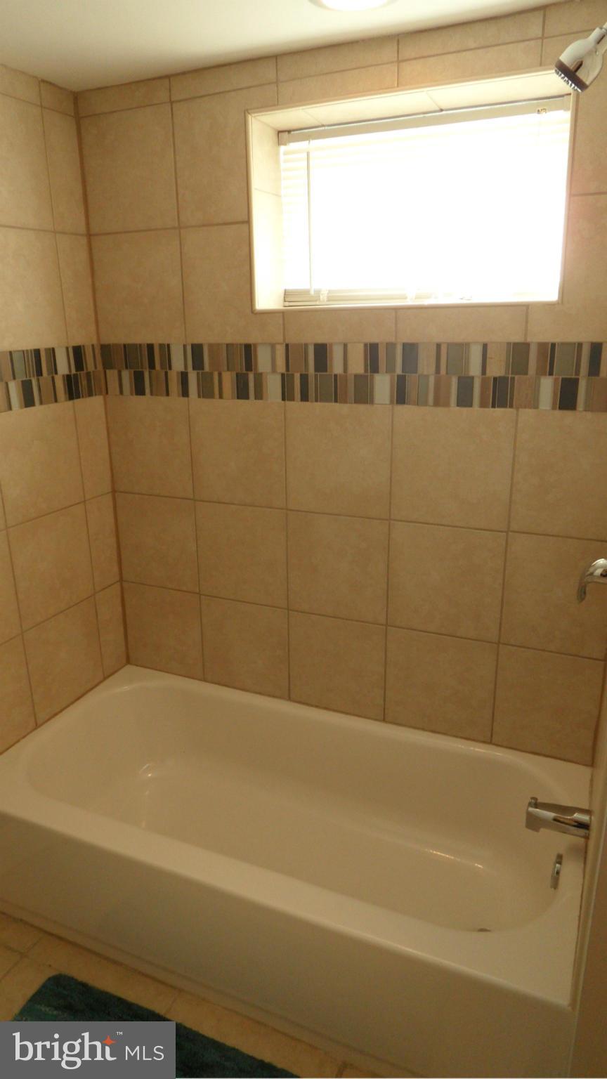 3832 Byfield Road Baltimore, MD 21207 - Photo 27 of 30 a bathroom with a bathtub