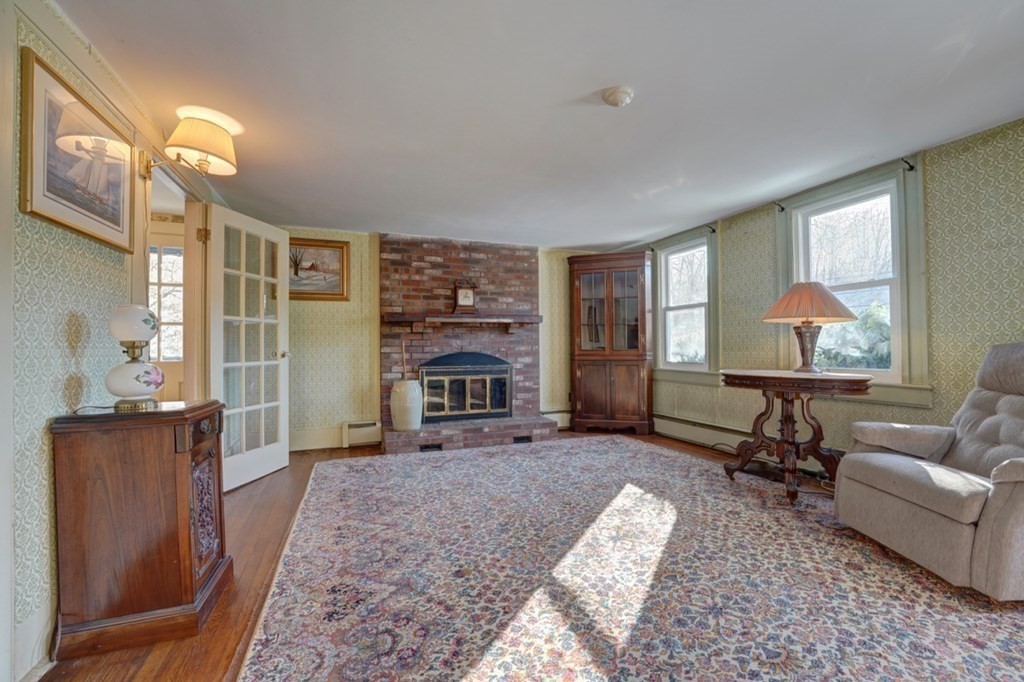 54 Lafayette Road Salisbury, MA 01952 - Photo 17 of 30 a living room with furniture and a fireplace