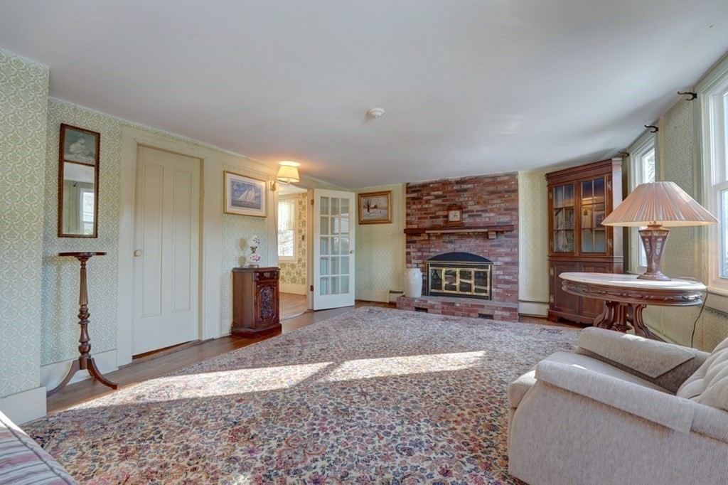 54 Lafayette Road Salisbury, MA 01952 - Photo 18 of 30 a living room with furniture and a fireplace