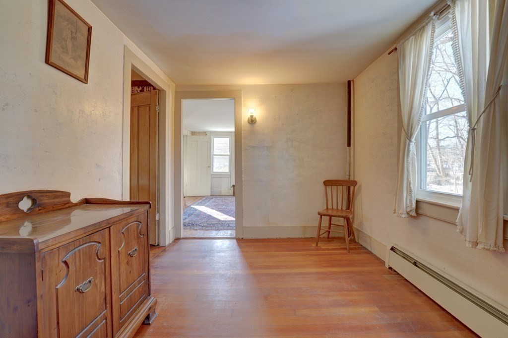 54 Lafayette Road Salisbury, MA 01952 - Photo 20 of 30 a view of a hallway with wooden floor and furniture