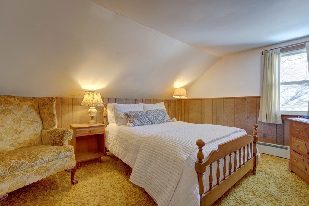54 Lafayette Road Salisbury, MA 01952 - Photo 22 of 30 a bedroom with a bed and a night stand