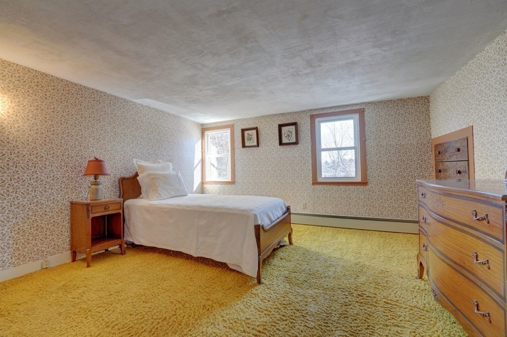 54 Lafayette Road Salisbury, MA 01952 - Photo 23 of 30 a spacious bedroom with a bed and a dresser in it