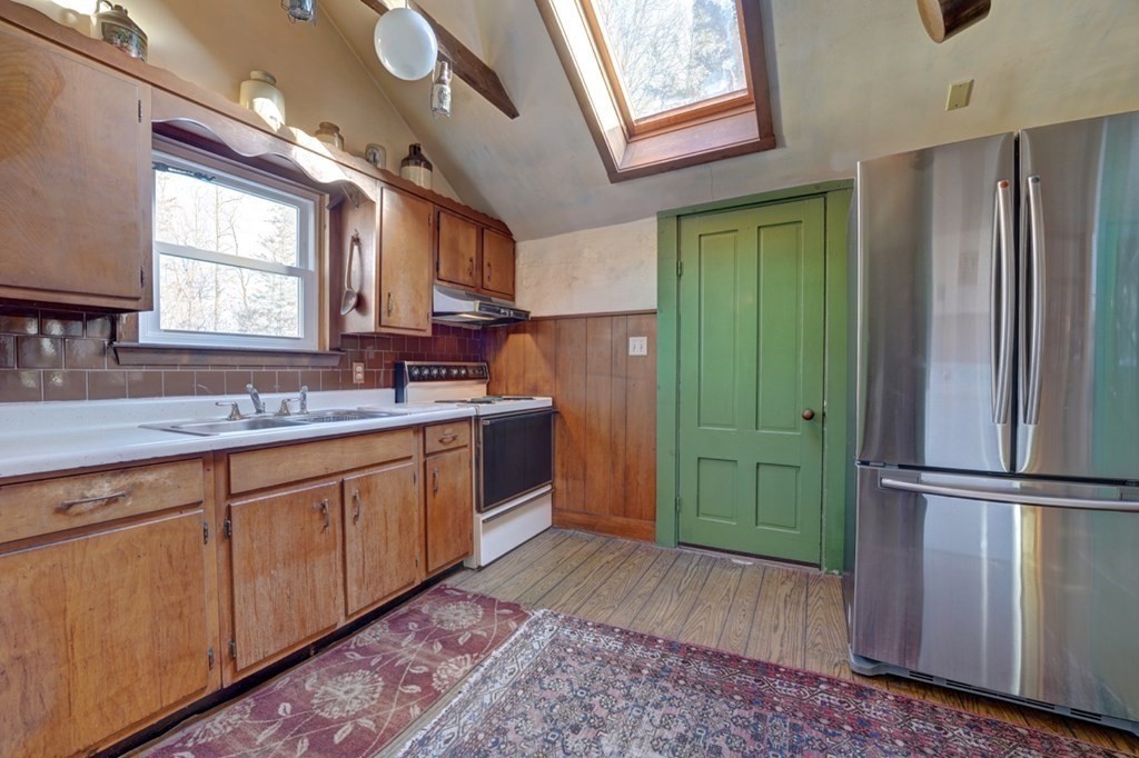54 Lafayette Road Salisbury, MA 01952 - Photo 10 of 30 a spacious bathroom with a sink a mirror and a shower