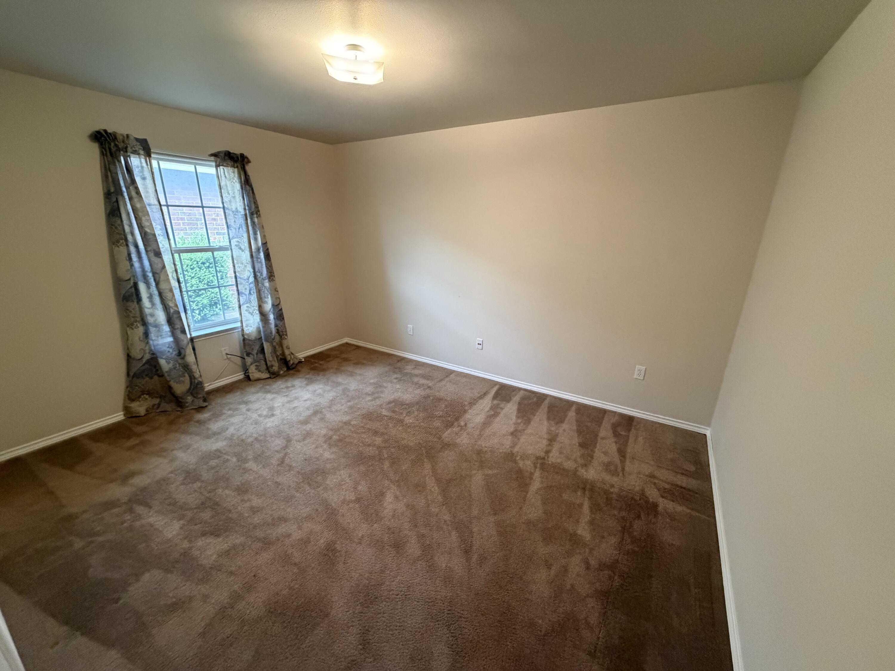 6544 84th Street Lubbock, TX 79424 - Photo 23 of 29 an empty room with windows