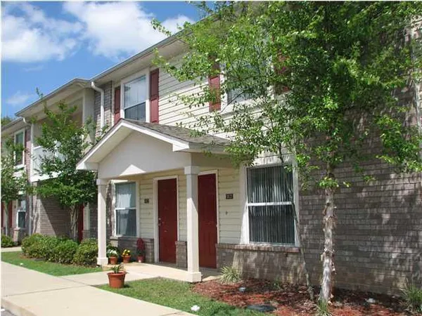 a front view of a house with yard