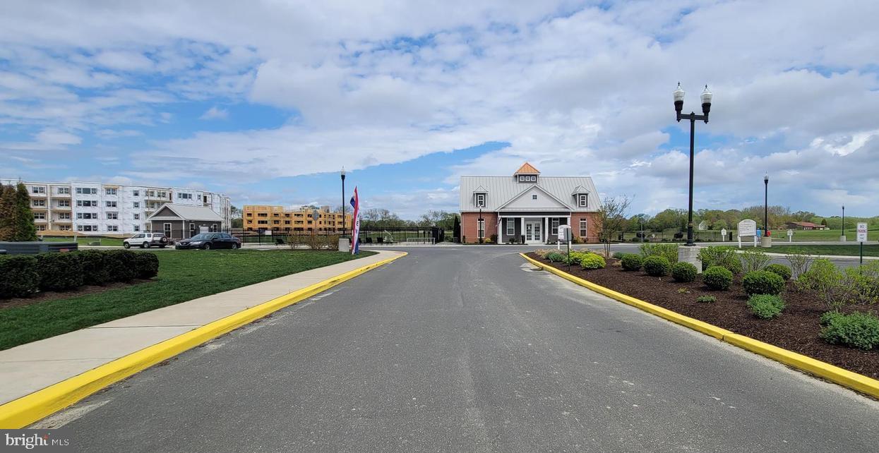 20141 Riesling Lane, Unit 309 Lewes, DE 19958 - Photo 12 of 12 a view of a city with tall buildings