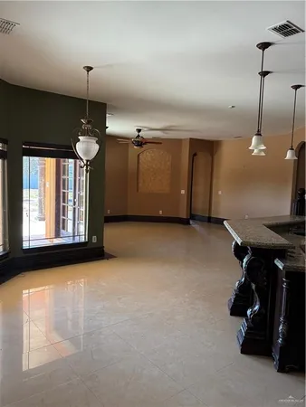 a view of a car garage with a hallway