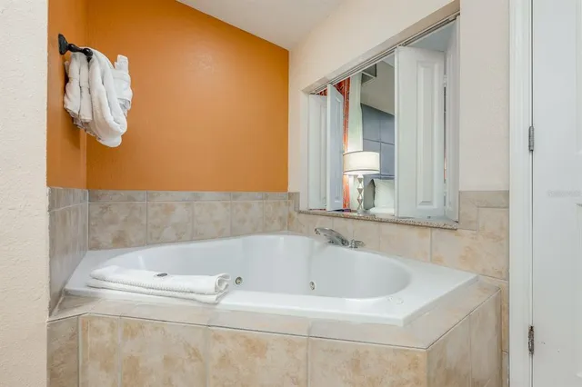 a bathroom with a bathtub and a shower