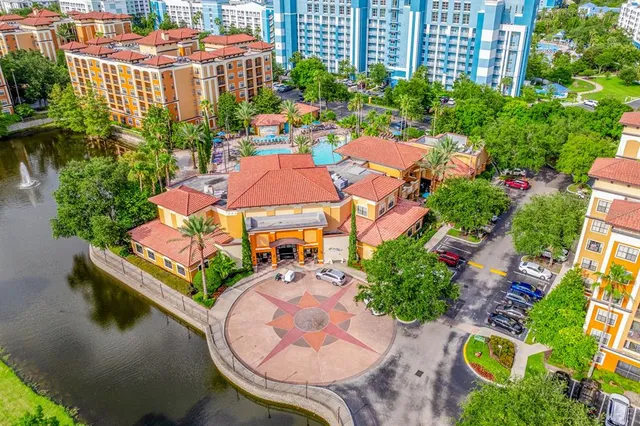 a view of a patio with a table and chairs and potted plants
