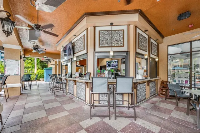 a room with lots of table and chairs