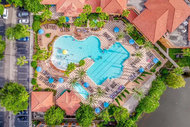 an aerial view of a house with a swimming pool