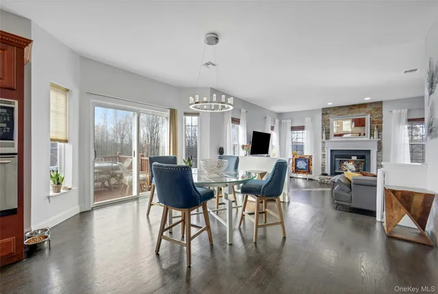 a view of a livingroom with furniture window and wooden floor