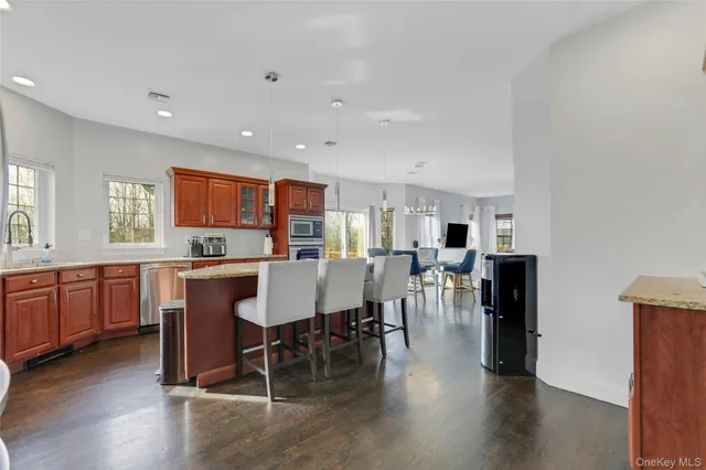 a large kitchen with a table and chairs
