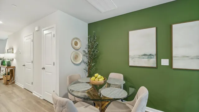 a view of a kitchen area with furniture and a potted plant