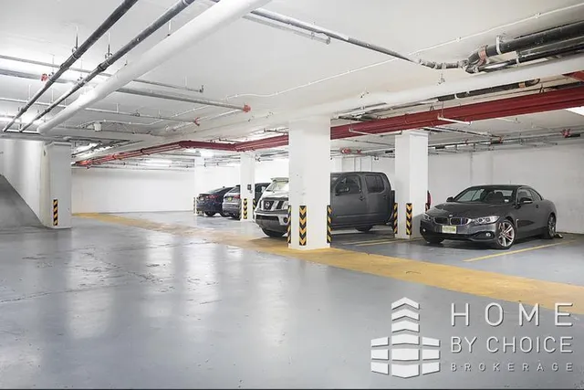 a view of parking garage with cars