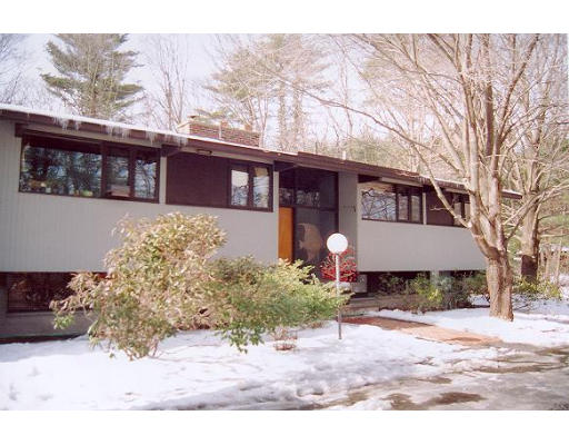 6 Stonehedge Road Lincoln, MA 01773 - Photo 1 of 1 a front view of a house with a yard and garage