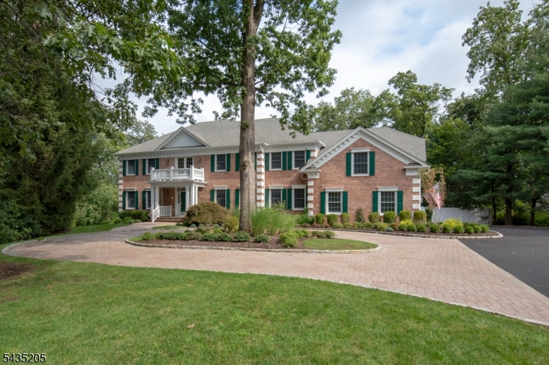 12 Oak Hill Road Bernards, NJ 07920 - Photo 5 of 33 a front view of a house with a garden