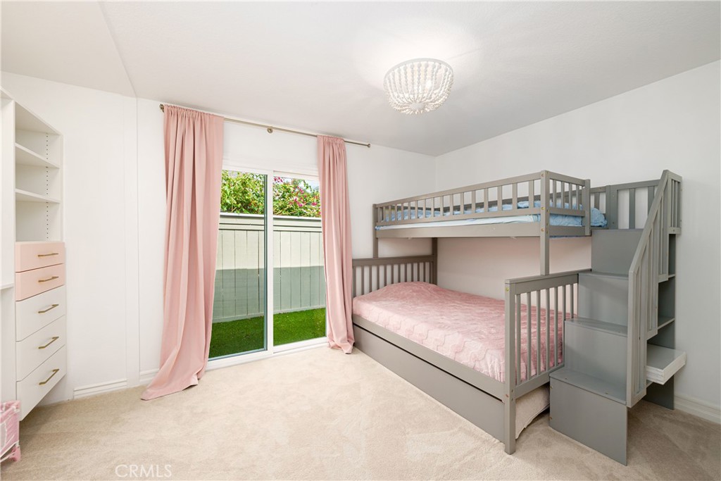 20 Wintermist Irvine, CA 92614 - Photo 20 of 51 a bedroom with a bed and a chandelier