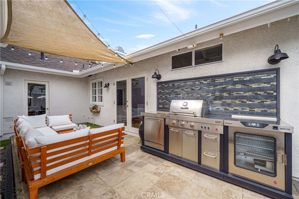20 Wintermist Irvine, CA 92614 - Photo 22 of 51 a kitchen with stainless steel appliances granite countertop a stove and a microwave