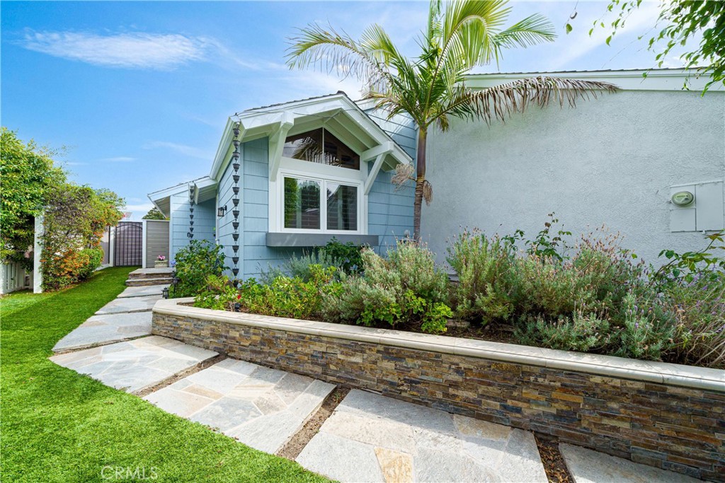 20 Wintermist Irvine, CA 92614 - Photo 30 of 51 a front view of a house with a garden