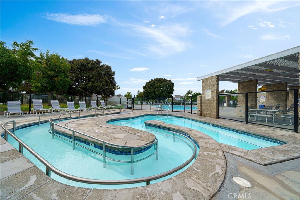 20 Wintermist Irvine, CA 92614 - Photo 36 of 51 a view of a swimming pool with a yard