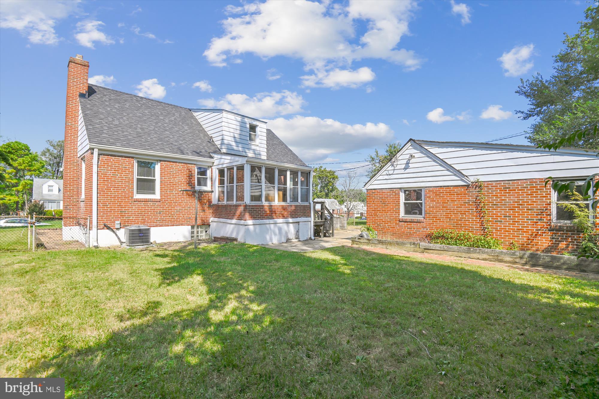 3415 Mayfair Road Gwynn Oak, MD 21207 - Photo 4 of 35 a front view of a house with a yard
