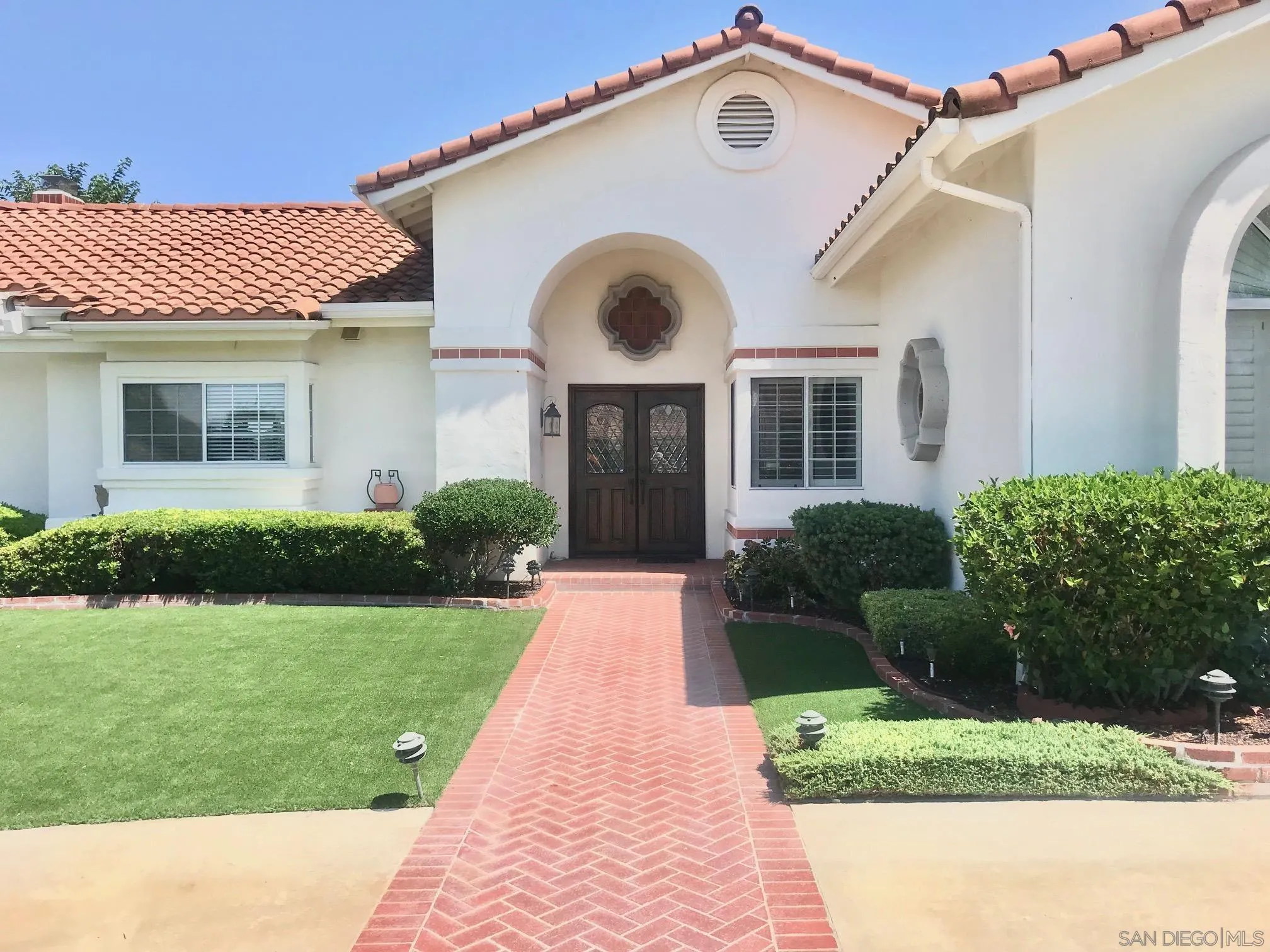 12650 Treehill Place Poway, CA 92064 - Photo 1 of 7 a front view of a house with garden and plants