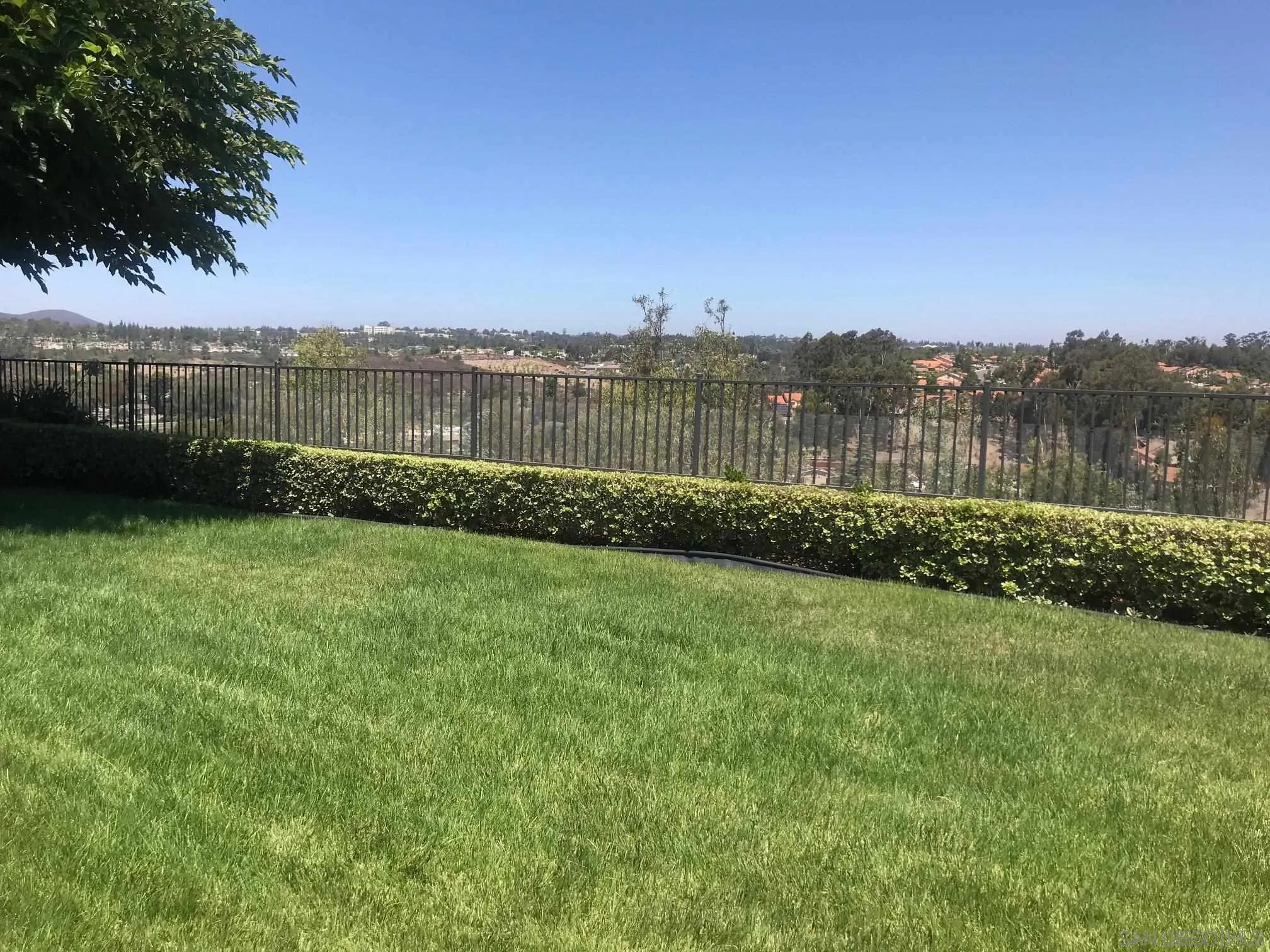 12650 Treehill Place Poway, CA 92064 - Photo 7 of 7 a view of a lake with houses in the back