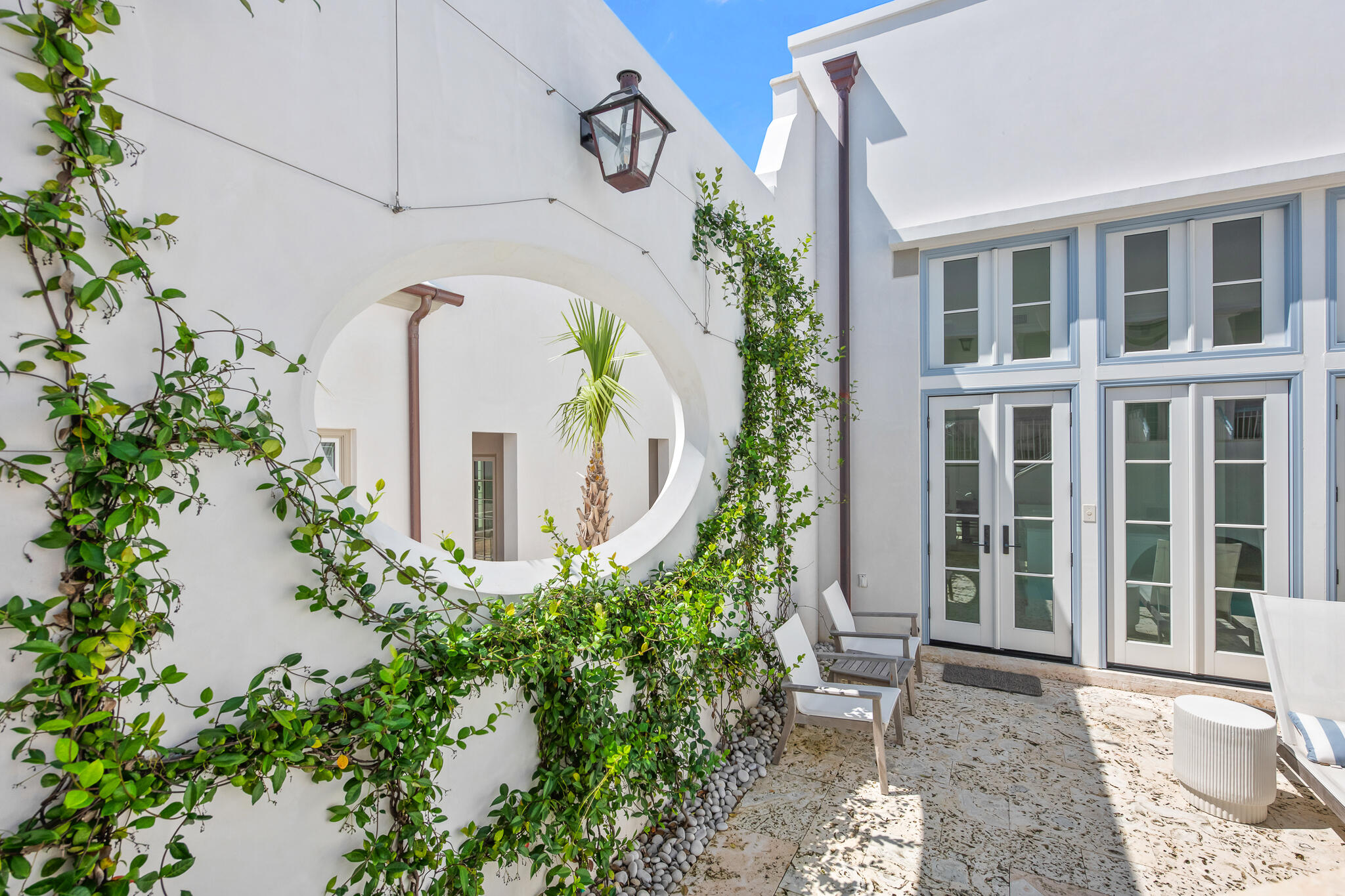 22 Sea Garden Street, Unit Z18 Inlet Beach, FL 32461 - Photo 25 of 44 a view of a building with potted plants
