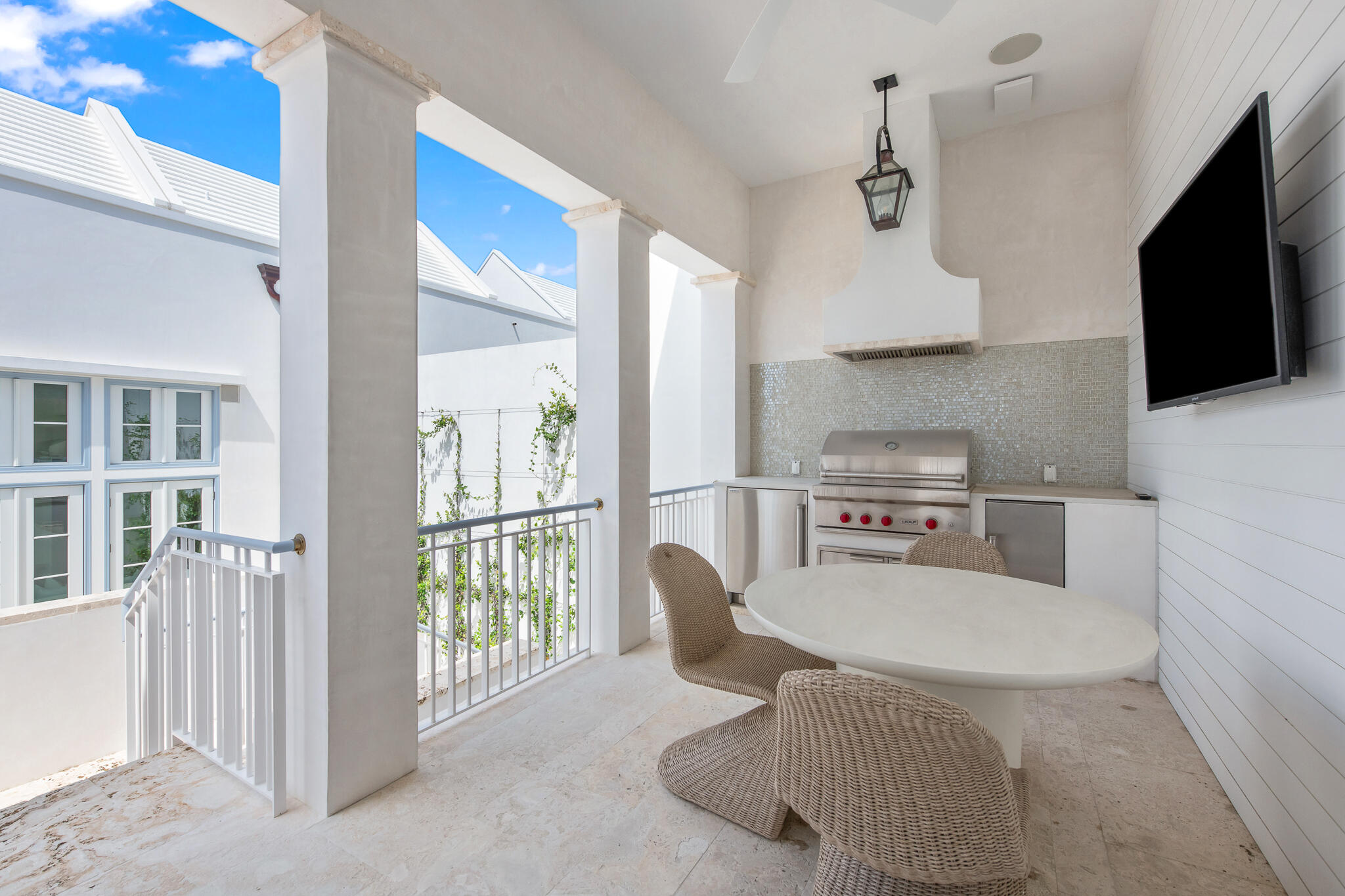 22 Sea Garden Street, Unit Z18 Inlet Beach, FL 32461 - Photo 27 of 44 a living room with furniture a flat screen tv and kitchen view