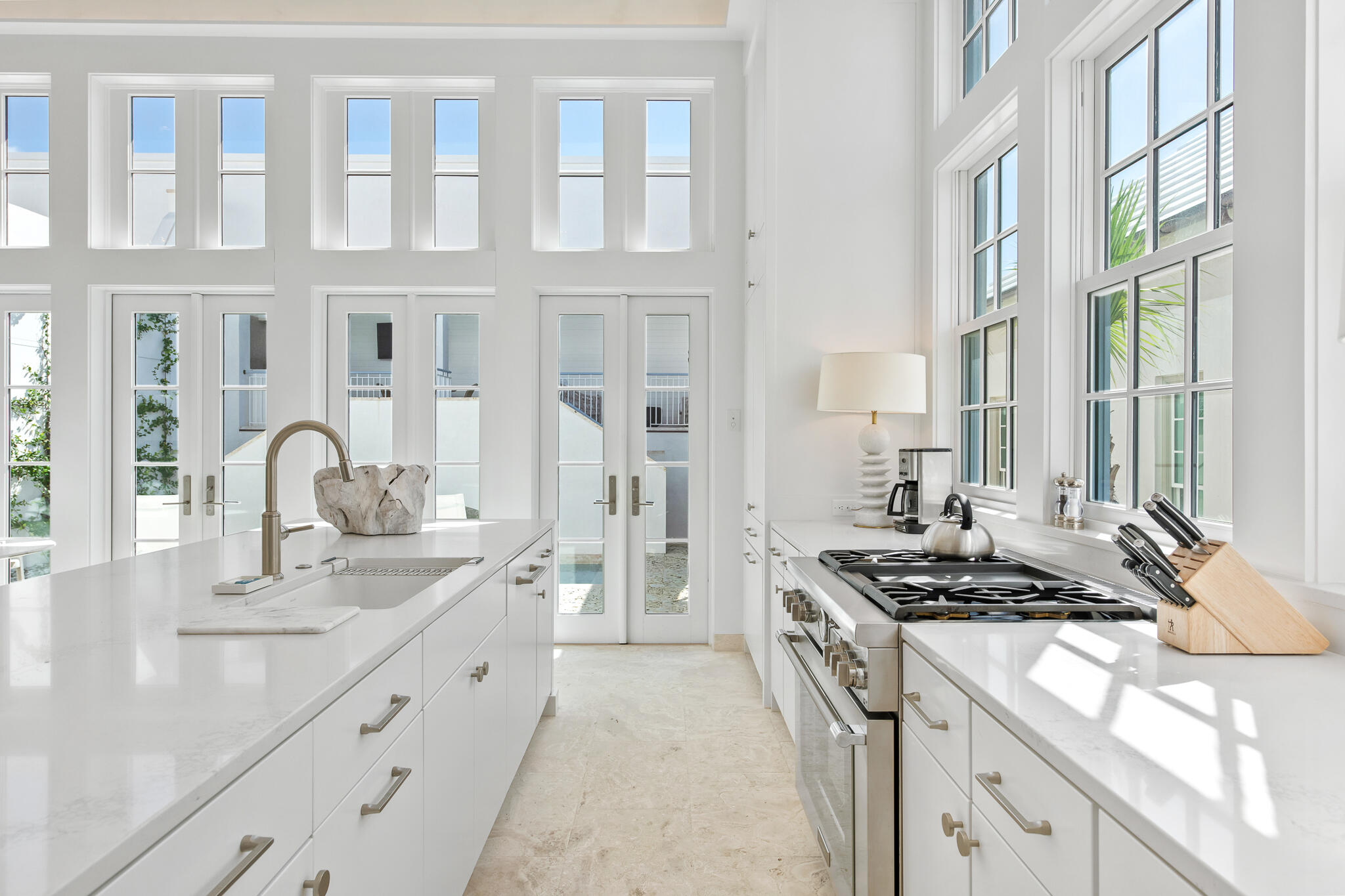 22 Sea Garden Street, Unit Z18 Inlet Beach, FL 32461 - Photo 9 of 44 a kitchen with stainless steel appliances granite countertop a sink stove and cabinets