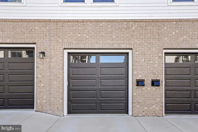 a front view of a house with garage