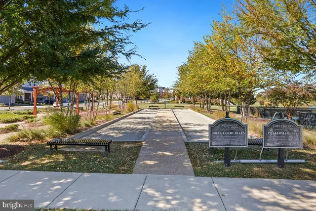 a view of a lake with houses in the back