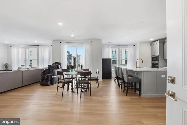 a view of a dining room with furniture window and wooden floor