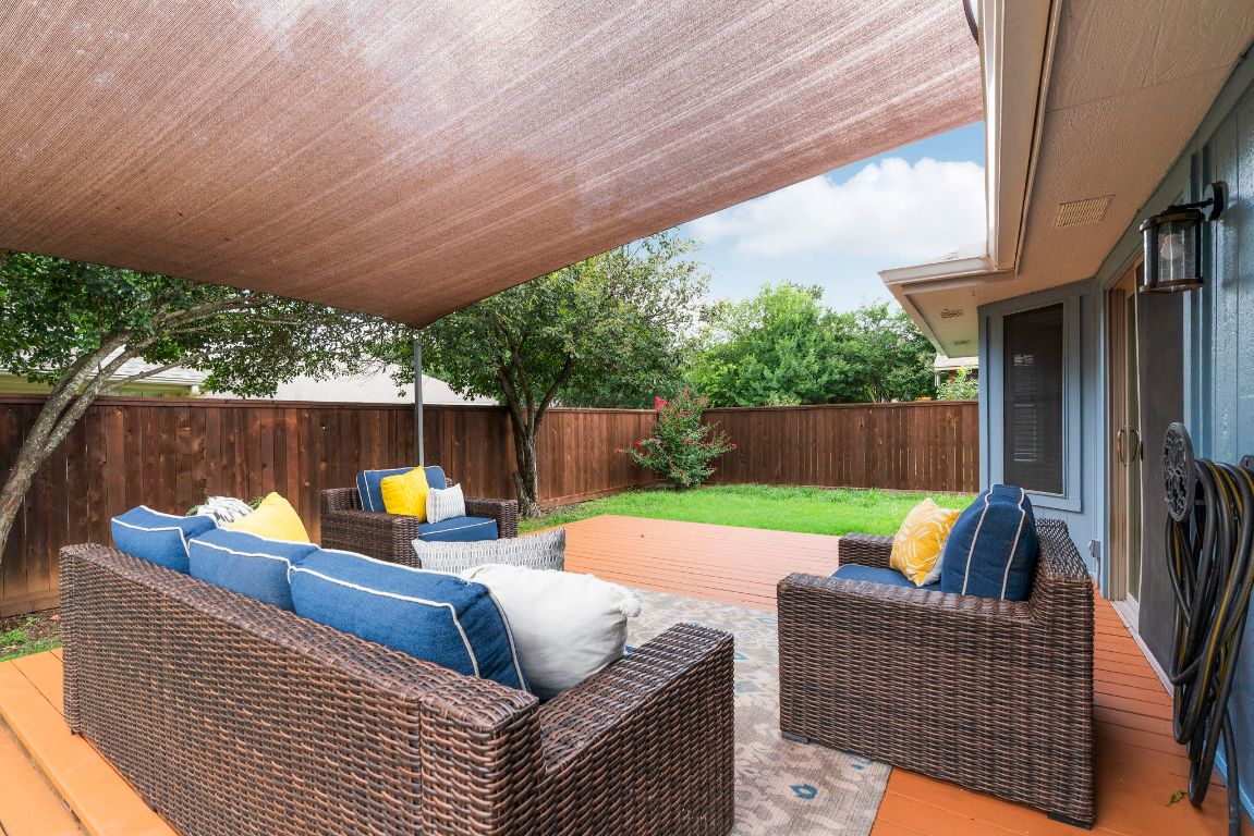 swimming pool view with a seating space