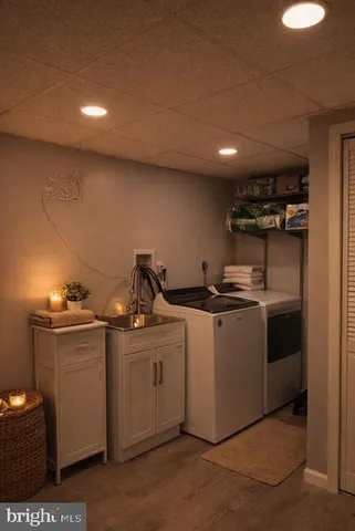 a kitchen with cabinets and window