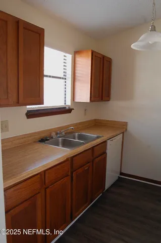 a sink sitting next to a window
