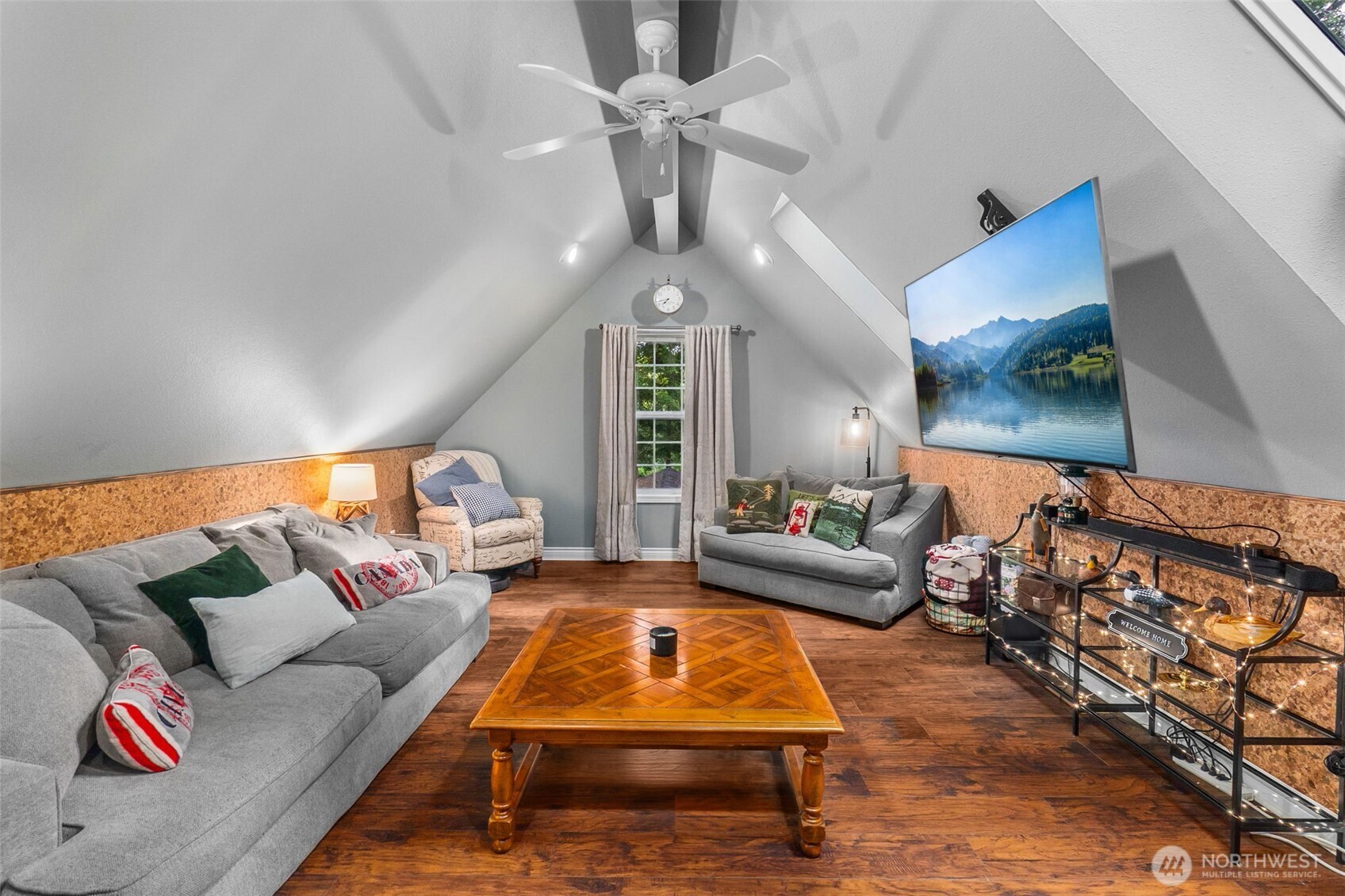 1130 East Sunset Hill Road Shelton, WA 98584 - Photo 29 of 40 a living room with furniture ceiling fan and a rug