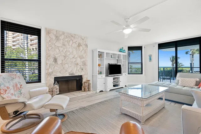 a living room with furniture fireplace and a flat screen tv