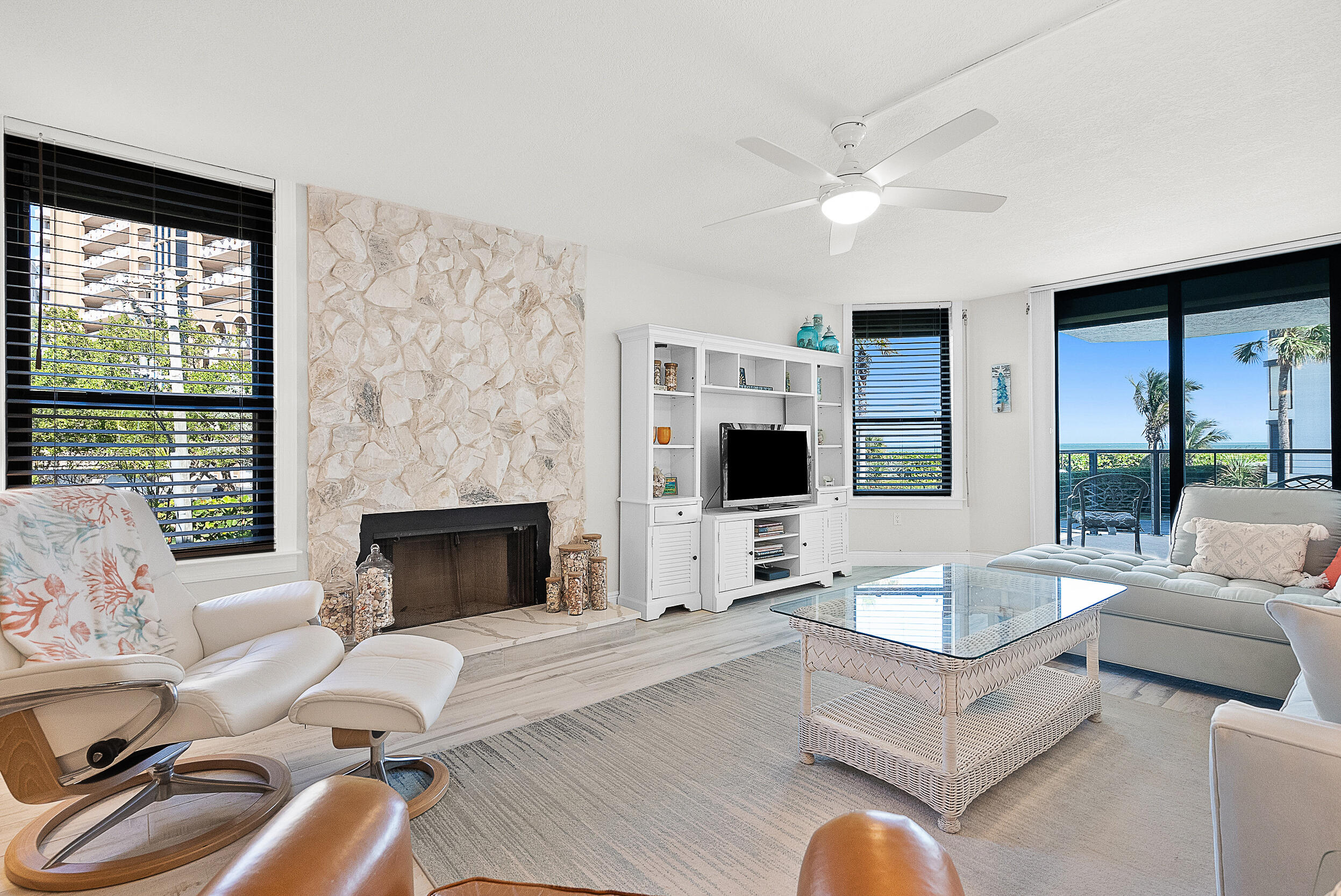 a living room with furniture fireplace and a flat screen tv