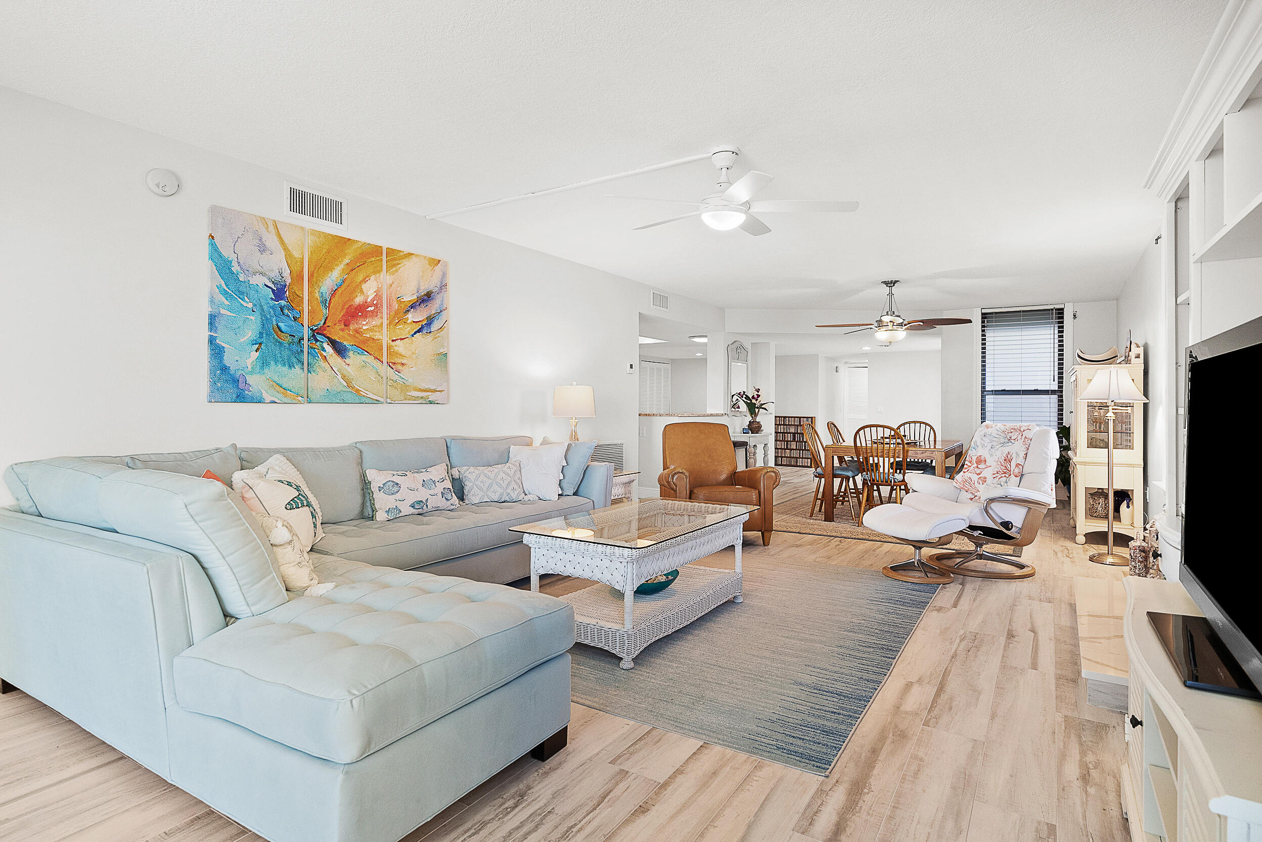 4100 North Hwy A1A, Unit 315 Hutchinson Island, FL 34949 - Photo 14 of 41 a living room with furniture and a flat screen tv