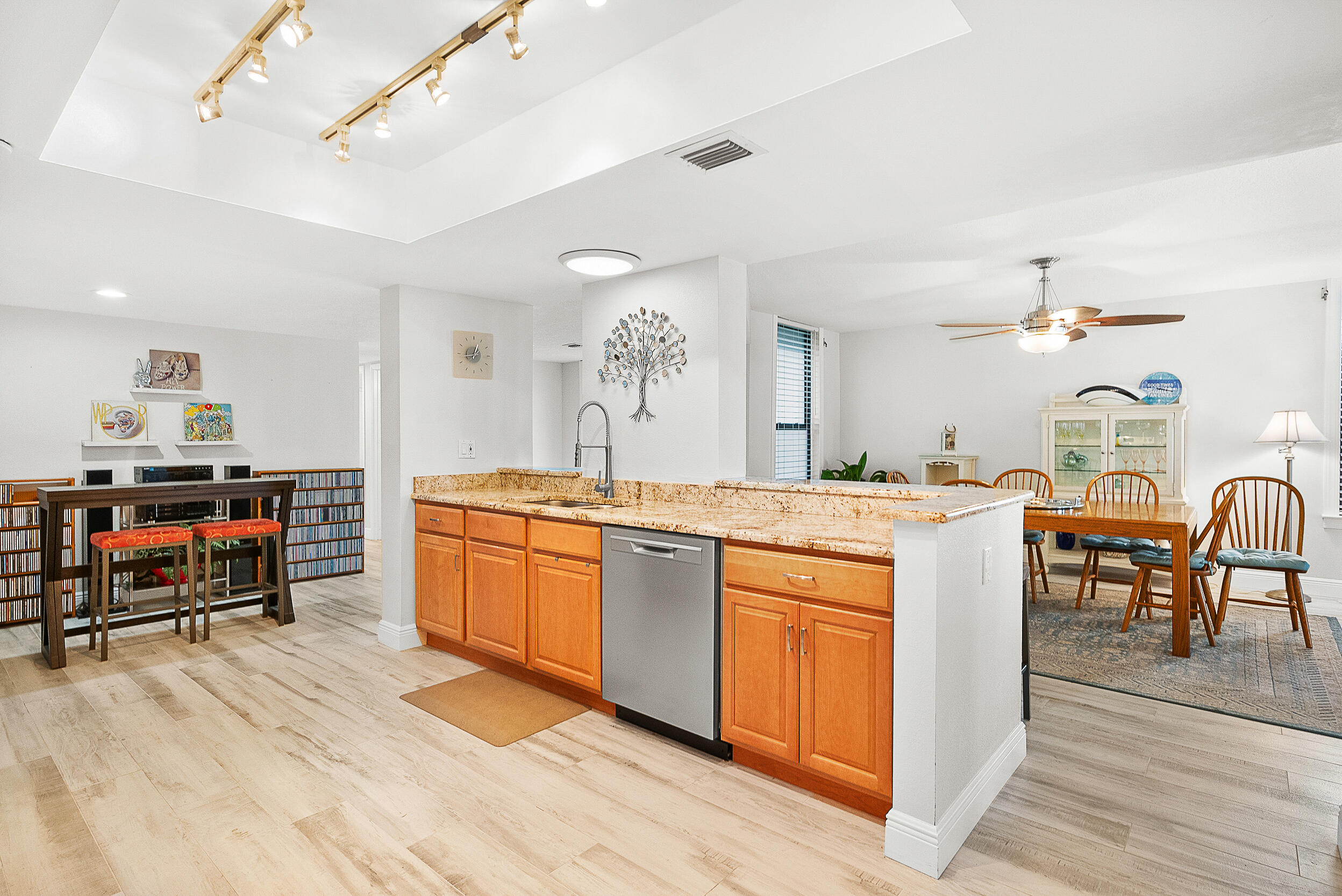 4100 North Hwy A1A, Unit 315 Hutchinson Island, FL 34949 - Photo 15 of 41 a large kitchen with a table and chairs in it
