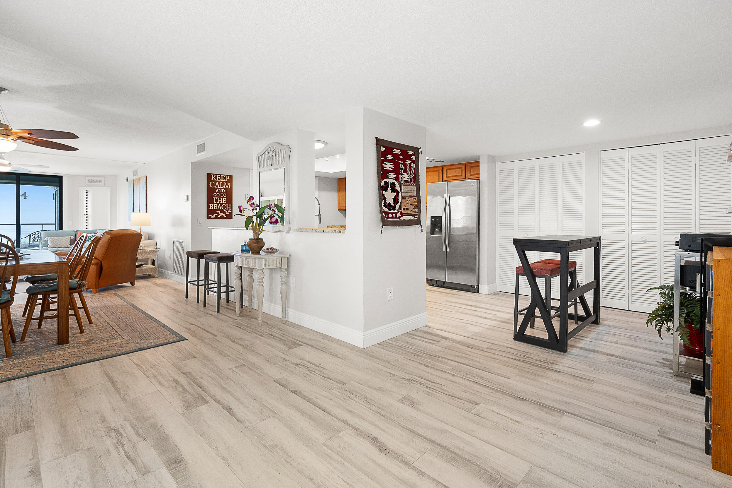 4100 North Hwy A1A, Unit 315 Hutchinson Island, FL 34949 - Photo 16 of 41 a view of a livingroom with furniture and wooden floor