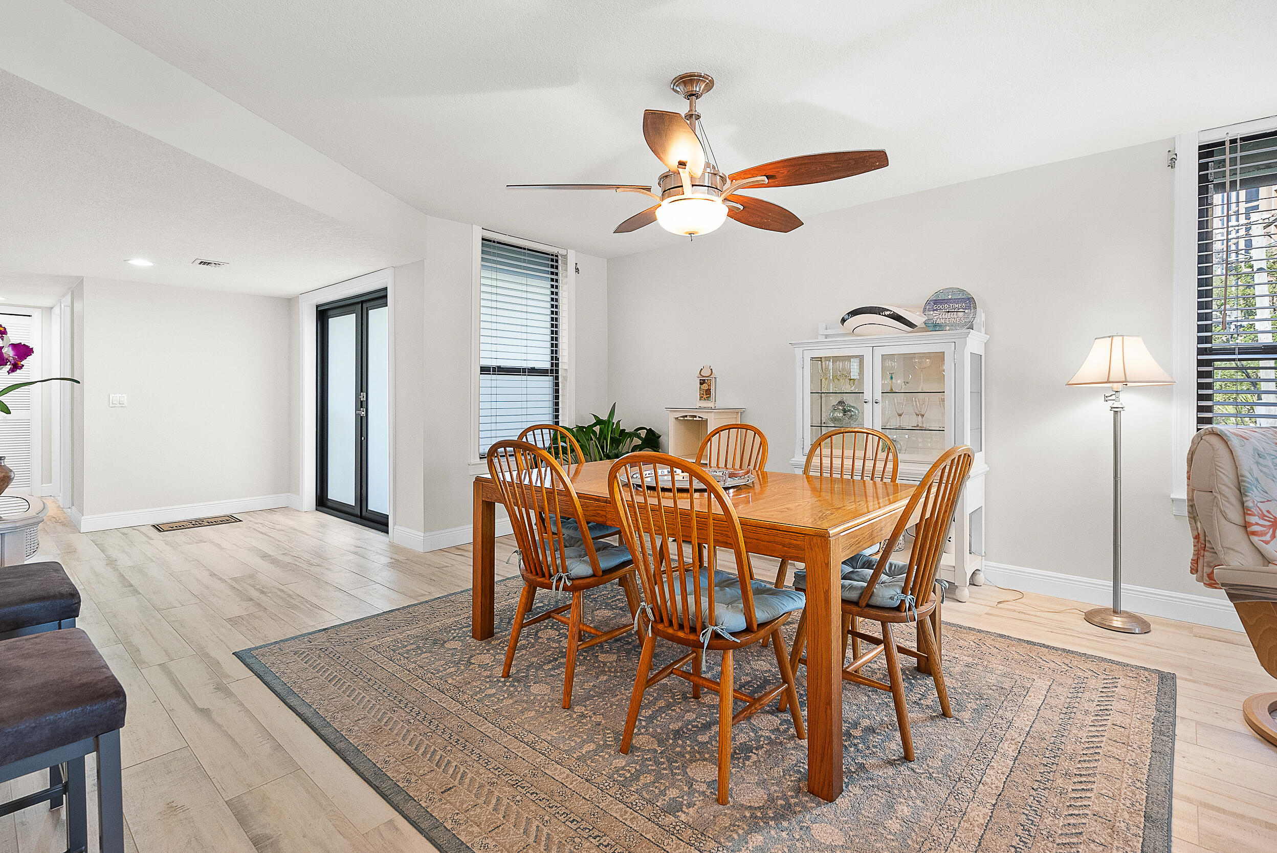 4100 North Hwy A1A, Unit 315 Hutchinson Island, FL 34949 - Photo 17 of 41 a view of a dining room with furniture and a chandelier