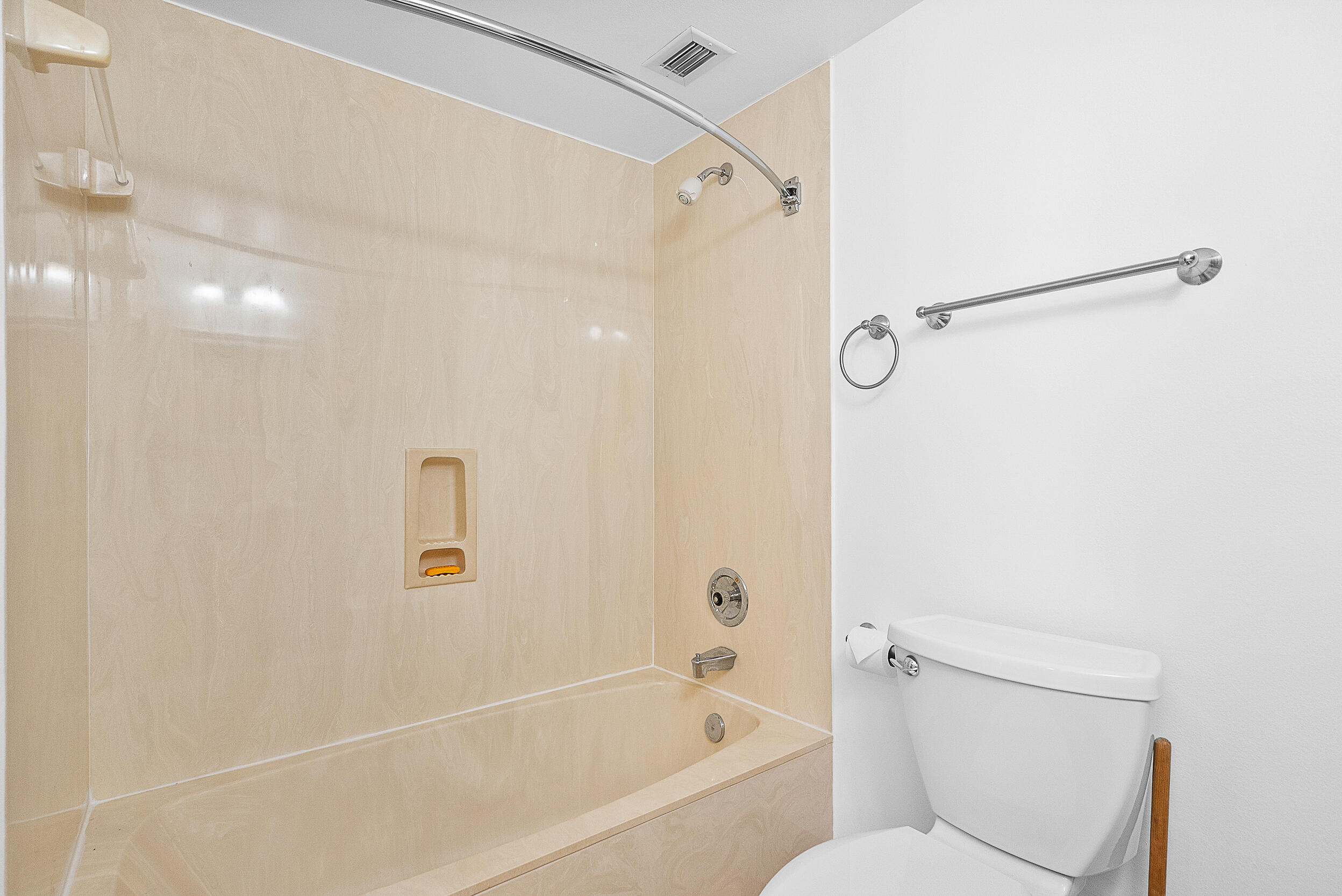 4100 North Hwy A1A, Unit 315 Hutchinson Island, FL 34949 - Photo 30 of 41 a bathroom with a toilet and a bathtub